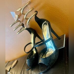Black and Gold High Heels with Unique Design